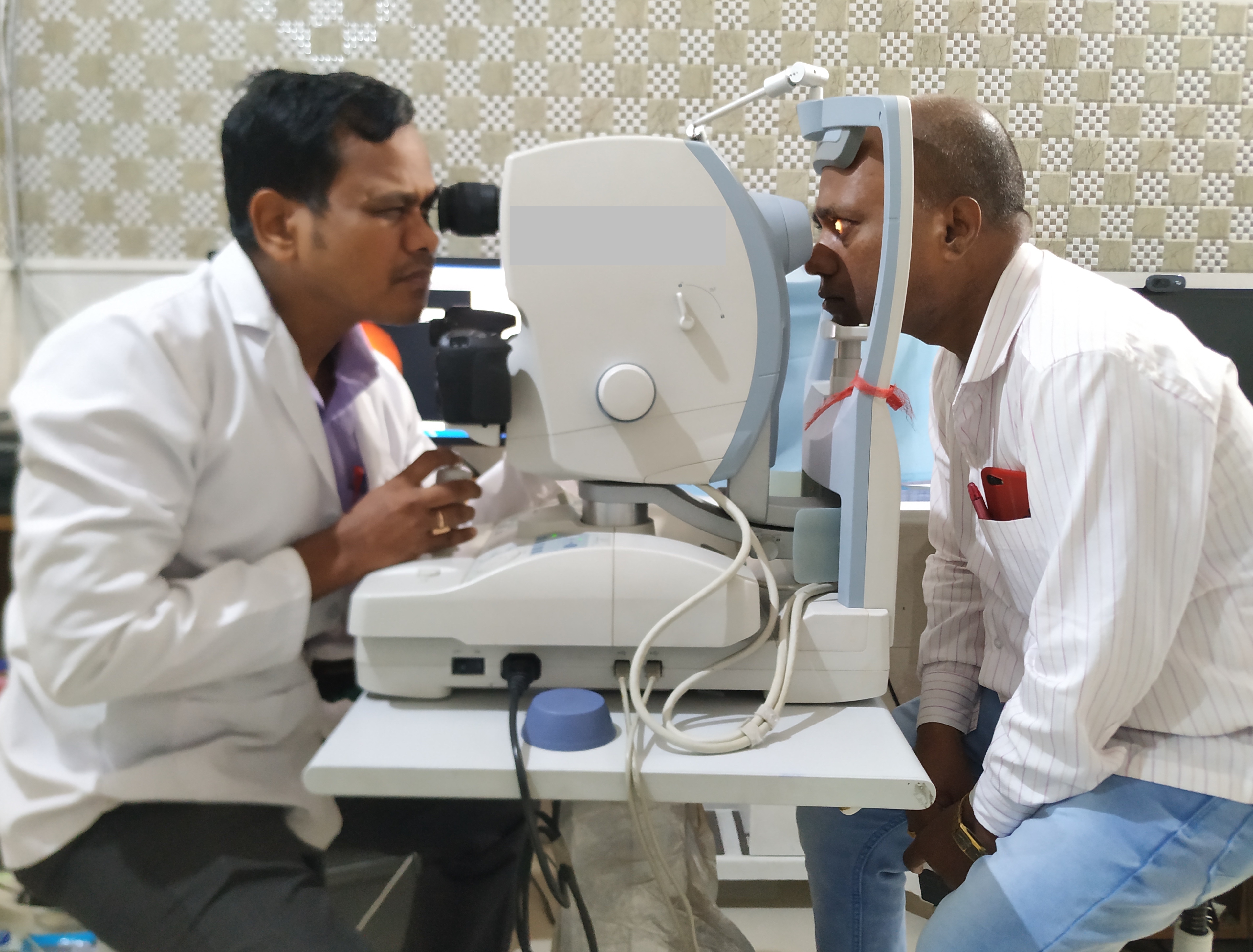 Fundus photo being taken in a fundus camera by the photographer 